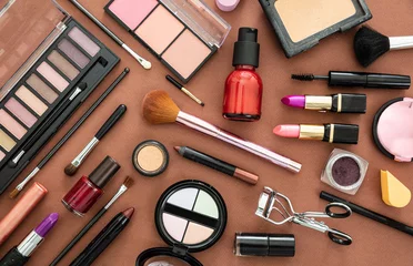 Foto op Plexiglas Schoonheidssalon Make up cosmetics products against brown color background