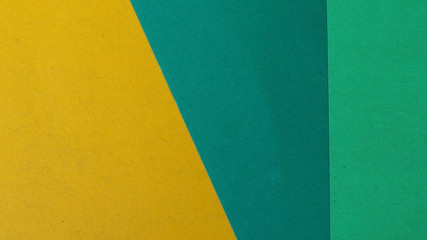 Yellow and green pastel color background, flat geometric paper