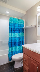 Vertical frame Interior of a small modern bathroom bright interior