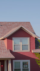 Vertical Partial facade of a modern red wooden house