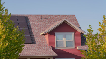 Panorama frame Partial facade of a modern red wooden house