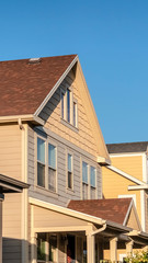 Vertical Row of double storey timber clad homes