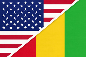 USA vs Guinea national flag from textile. Relationship between two american and african countries.