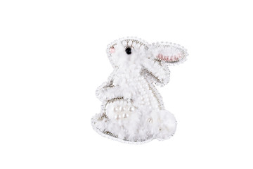 Brooch made of handmade colored beads on the background