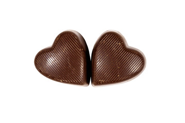 Two heart shaped chocolate candies isolated on white background