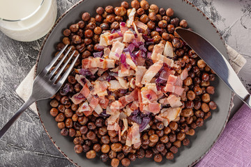 Traditional Latvia food, grey peas with bacon and onion, copy space