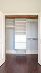 Vertical Interior of an empty walk-in closet in a new house