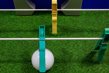 clothespins lined up in the form of a football kicker