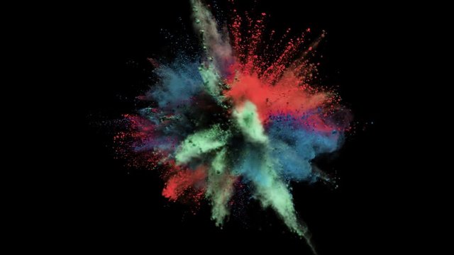 Colored powder explosion, abstract close up dust isolated on black background in slow motion