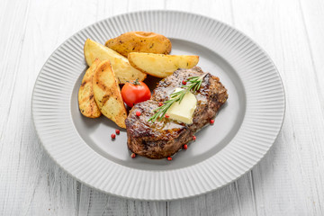 Useful and tasty food, grilled beefsteak with french fries