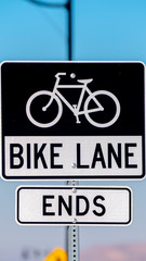Fototapeta premium Vertical Warning traffic sign for the end of a Bike lane