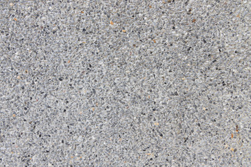 Close up texture of Light Grey washed gravel stone wall pattern background.