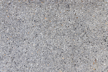 Close up texture of Light Grey washed gravel stone wall pattern background.
