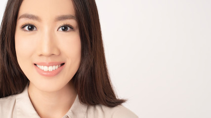 Naklejka premium Close up of Asian woman with beautiful teeth on white background
