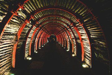 Colombia. An unusual church near Bogotá in a salt grotto. Dark tunnel with red arcs.