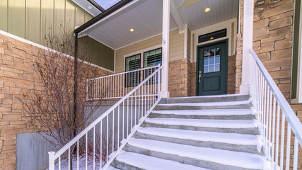 Fototapeta premium Panorama frame Fresh white snow covering a flight of steps