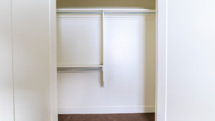 Fototapeta na wymiar Panorama Empty interior of an open white closet