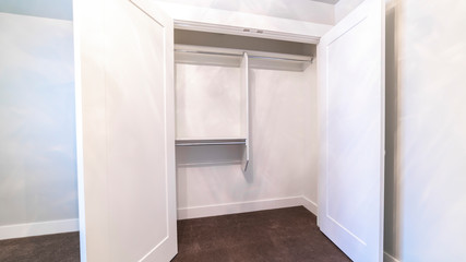 Panorama frame Open door of an empty clothes closet