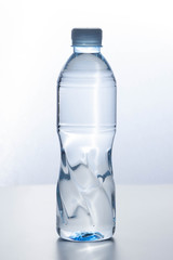 Fototapeta premium Plastic bottle Placed on a light background. Vertical.