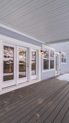 Vertical frame Wooden deck on a covered exterior patio in winter
