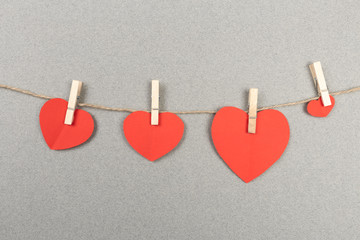 Fototapeta premium happy valentine's day in love and clothes pegs - Image