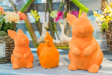 Easter figurines - rabbits and a an on a shop display.