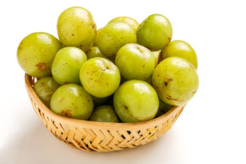 Fresh Indian gooseberry in wooden  bowl 