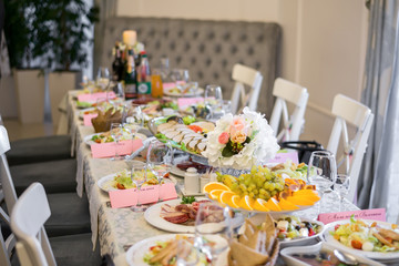 tableful. Festive table with food drinks and flowers