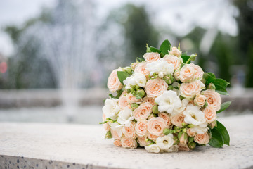 beautiful wedding bouquet on the background of nature fountain