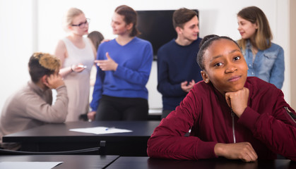 Fototapeta premium girl student feeling uncomfortable at break between classes