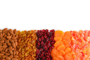Mix of dried fruits and nuts. Apricot, raisin, cranberry, dates fruit. Isolated on a white background. Space for text or design.