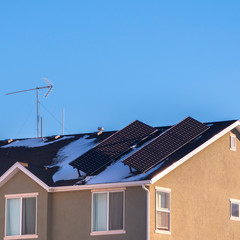 Fototapeta premium Square Two angled solar panels on a house roof