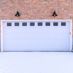 Square frame Garage forecourt covered in snow day light