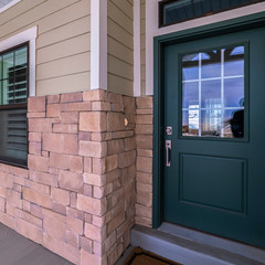 Square Green front door with glass pane day light