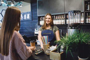 Barista woman in the bar.
