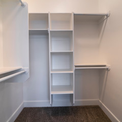 Square frame Fitted interior of a walk-in wardrobe bright interior