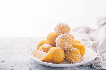 Homemade Raw Vegan Coconut and Lemon Truffles. Vegetarian food concept. Copy space.