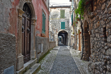Guarcino, Italy, 01/03/2020. An alley between the old houses of a medieval village.