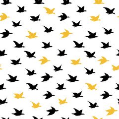 Black and Yellow Crane Birds Japanese Seamless Pattern with Simple Birds Silhouettes for pillows print design, wallpapers, backdrops or fabric textile. Flying elegant black swallows, white blackground