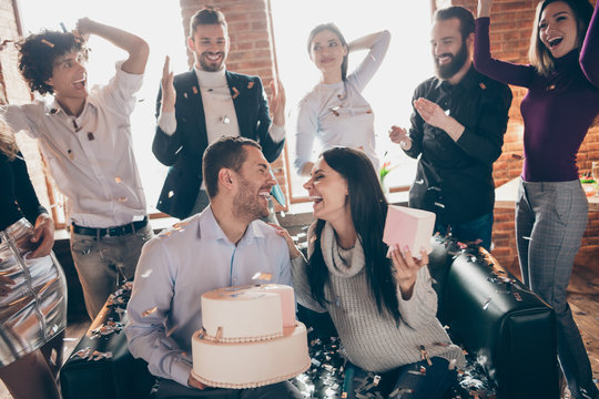 Photo Of Group Friends Arranging Surprise Baby Party Wedding Anniversary Future Parents Sit Sofa Hold Big Cake Kissing Confetti Fall Wear Formalwear Restaurant Indoors