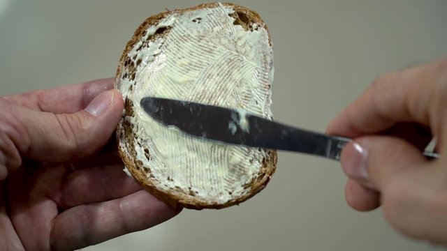 Spread butter on bread and drop it on the floor. Slow motion.
