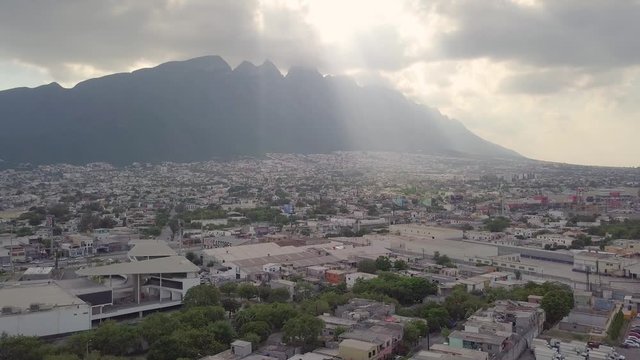 Stationary Aerial Perspective Pans LTR from Cerro de las Mitras to Monterrey Mexico Cityscape Below