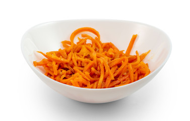 Korean carrot-salad of sliced carrots, garlic, vegetable oil and seasonings on a white salad bowl isolated white background