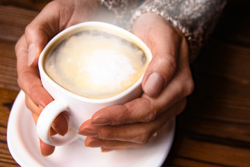 female hands and coffee