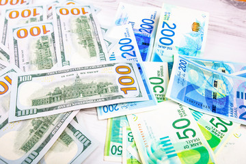 Israeli and American banknotes. Shekel and American dollars.