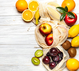 Mesh shopping bags with fruits