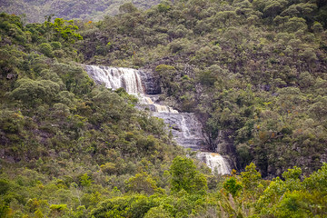 Fototapeta na wymiar Waterfall cascading in dense forest, Caraca natural park, Minas Gerais, Brazil