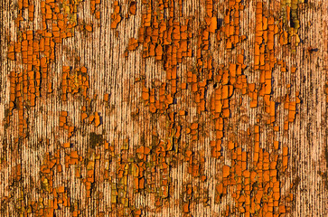 Old wooden boards with worn brown varnish as background