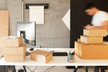 Fototapeta premium Delivery service, working in warehouse with packages 