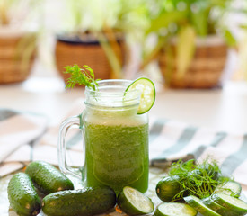 the process of making fresh juice or cucumber smoothies, detox smoothies and juices, weight loss diet